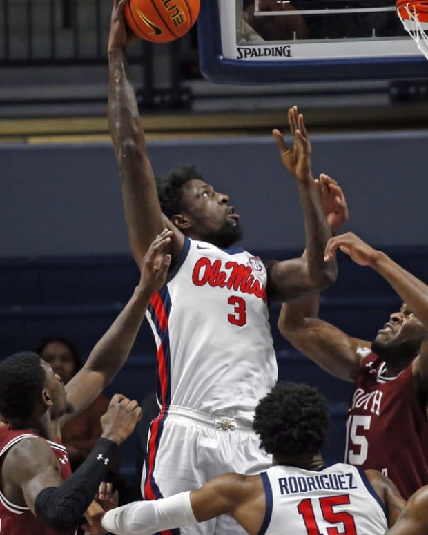 Feb 15, 2022; Oxford, Mississippi, USA; Mississippi Rebels center Nysier Brooks (3) shoots as South Carolina Gamecocks forward/center Wildens Leveque (15) defends during the first half at The Sandy and John Black Pavilion at Ole Miss. Mandatory Credit: Petre Thomas-USA TODAY Sports